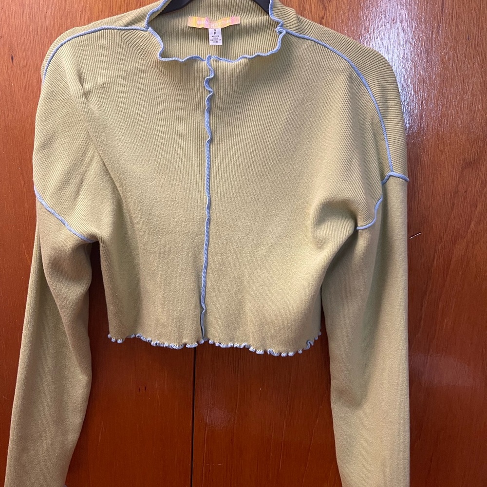 light green cropped sweater with blue trim